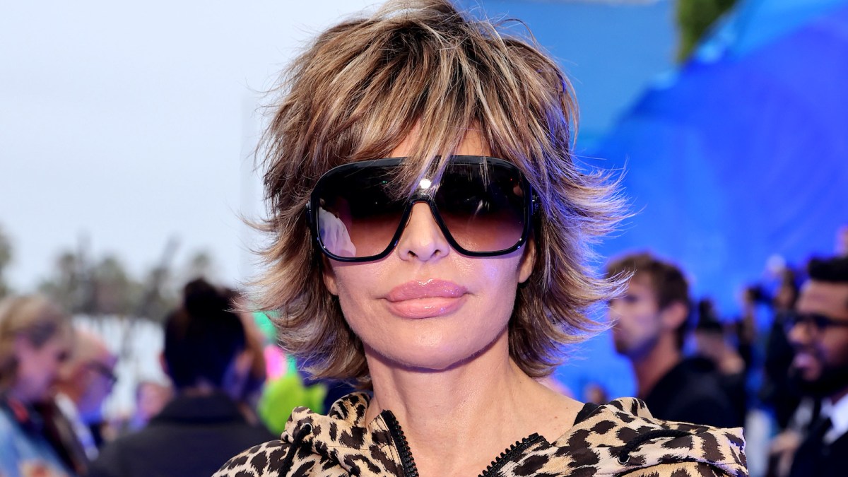Close up of Lisa Rinna wearing oversized sunglasses and signature pixie cut