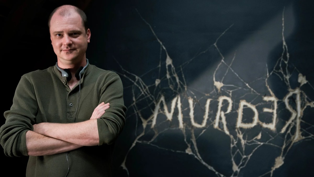 Mike Flanagan in front of the Murder/Redrum sign from Doctor Sleep