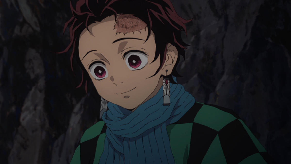 Tanjiro smiles at Nezuko. 