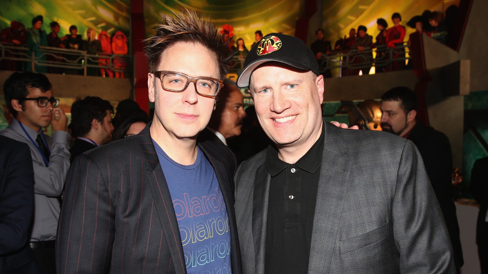 James Gunn and Kevin Feige pose for a photo together at a red carpet event.
