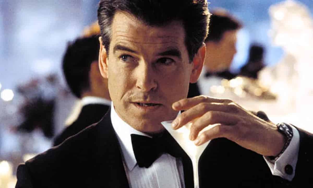 Pierce Brosnan sips a martini as James Bond