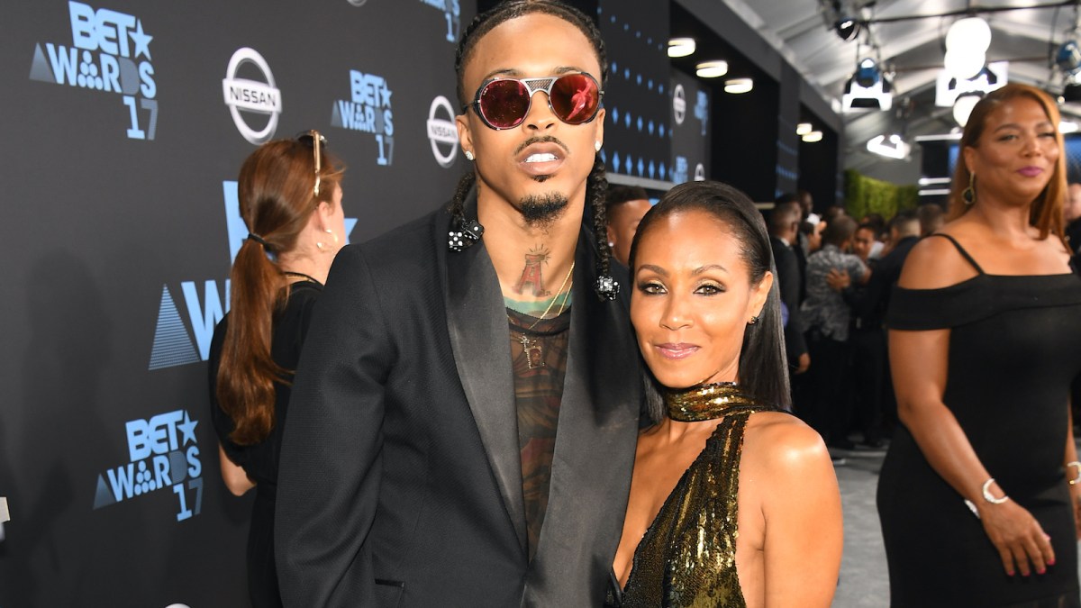 August Alsina and Jada Pinkett Smith posing together on the red carpet