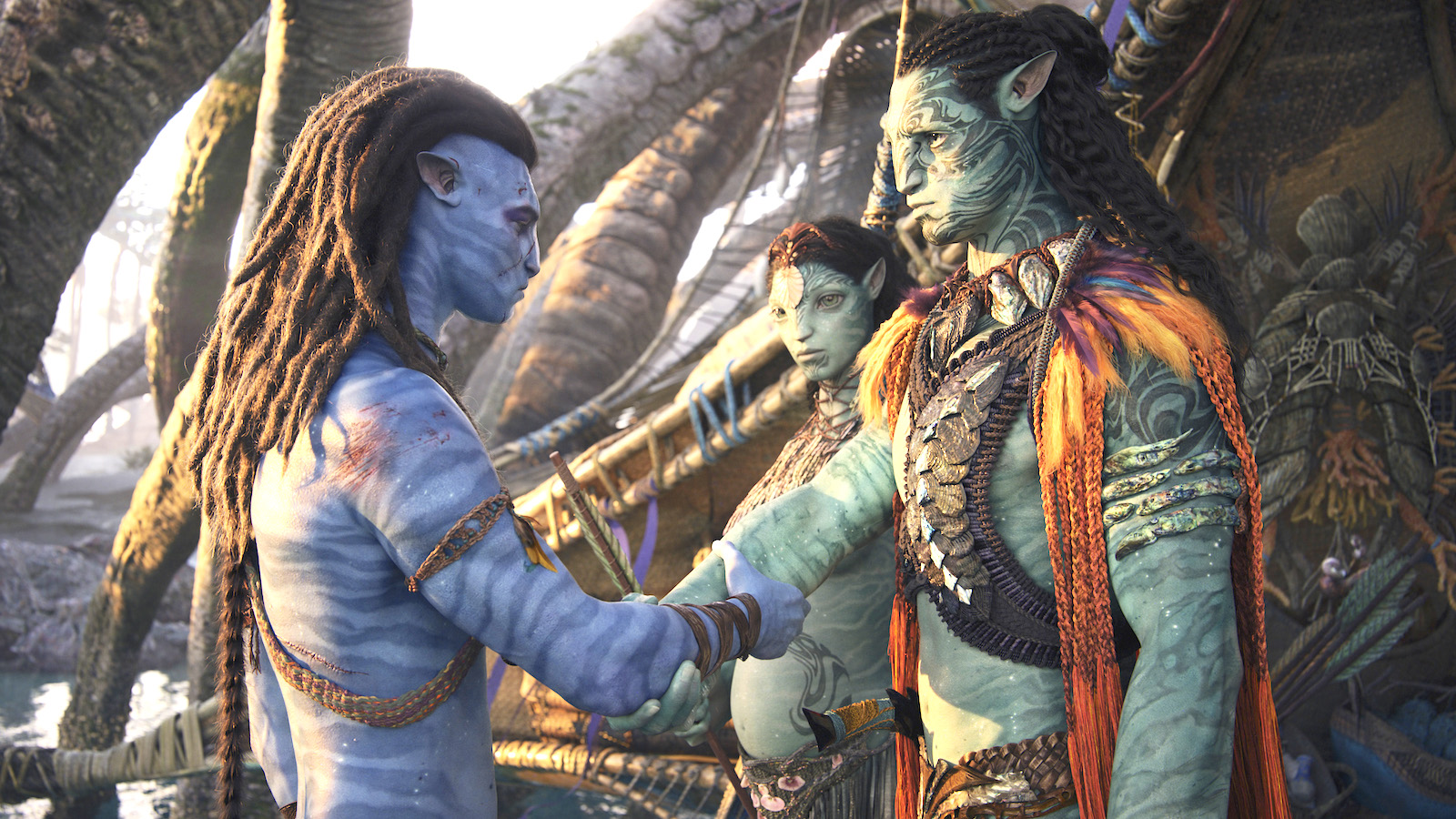 A still shot of Jack Sally with a green Na'vi tribe leader and a pregnant green Na'vi