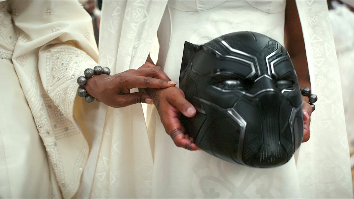 Image of Chadwick Boseman's Black Panther helmet in the hands of Shuri in 'Black Panther: Wakanda Forever'