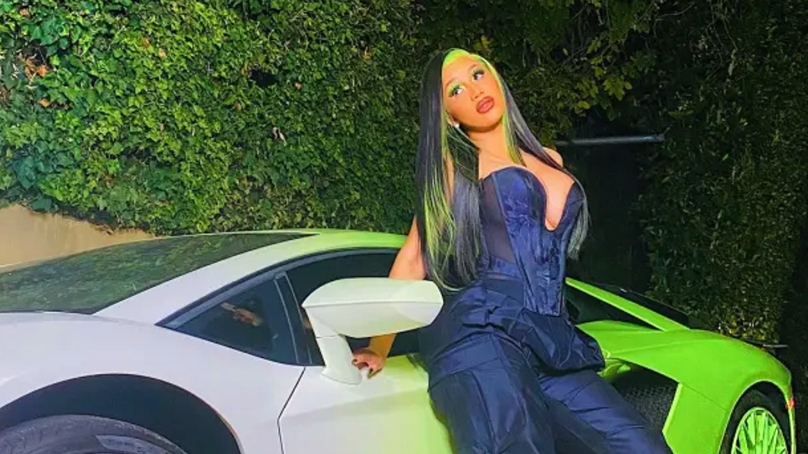 Cardi B with her car 