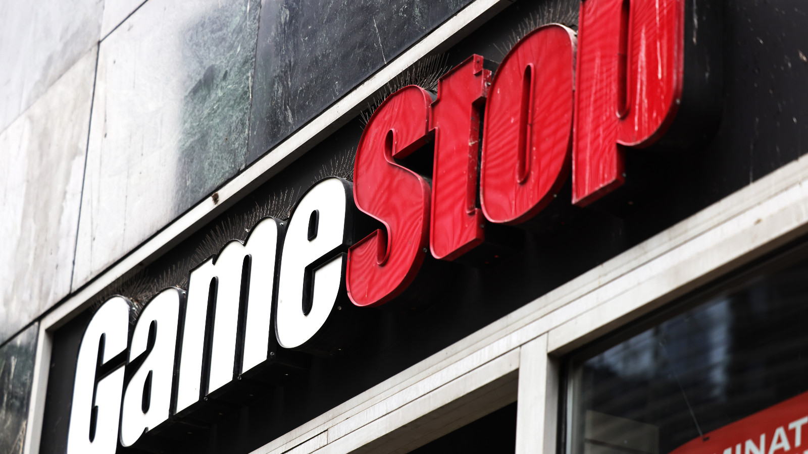 GameStop store signage is seen on January 27, 2021 in New York City. Stock shares of videogame retailer GameStop Corp has increased 700% in the past two weeks due to amateur investors.