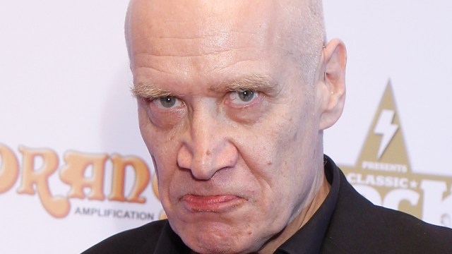 Wilko Johnson poses at the boards at the Classic Rock Roll of Honour at The Roundhouse on November 14, 2013 in London, England.