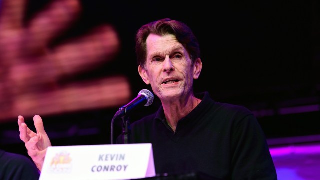 Kevin Conroy fields questions from fans at a Q&A event.