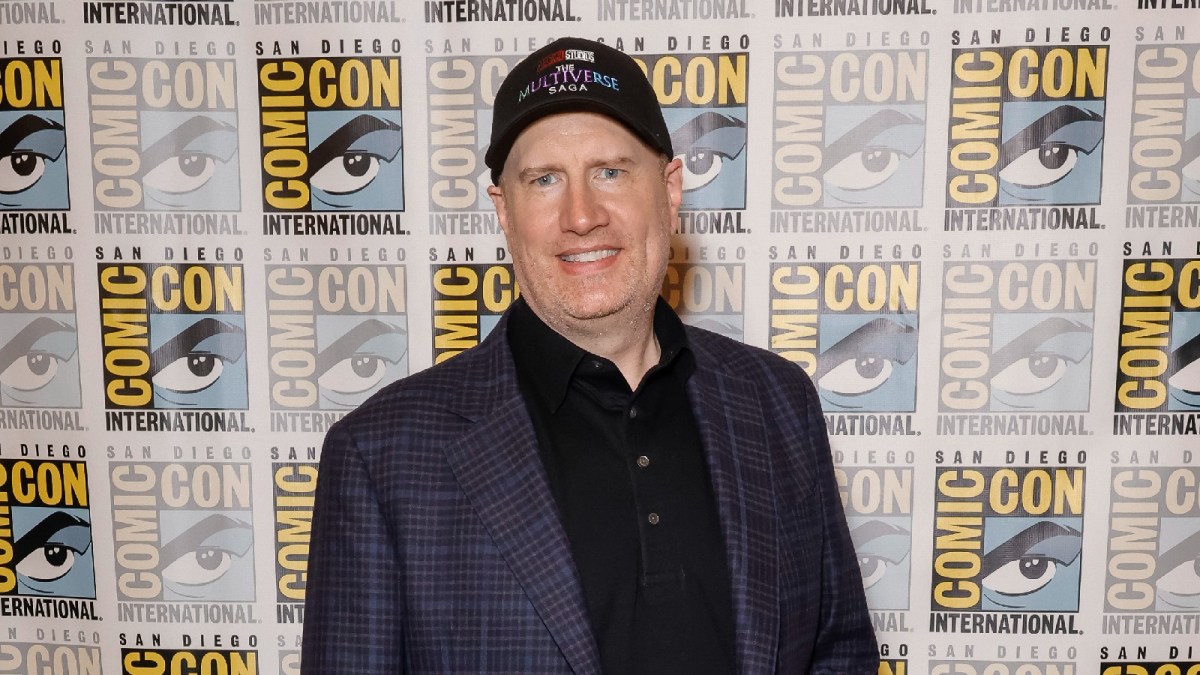 Kevin Feige strikes a pose at a red carpet event.