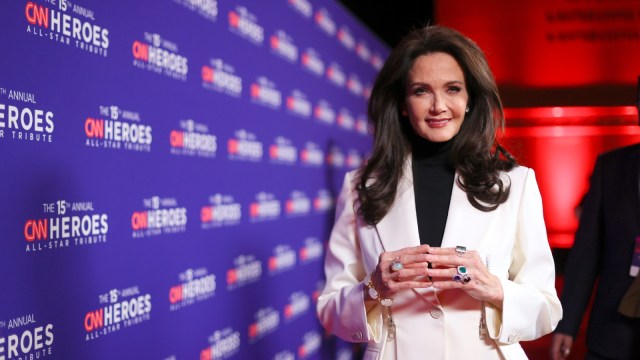 Lynda Carter strikes a pose at a red carpet event.