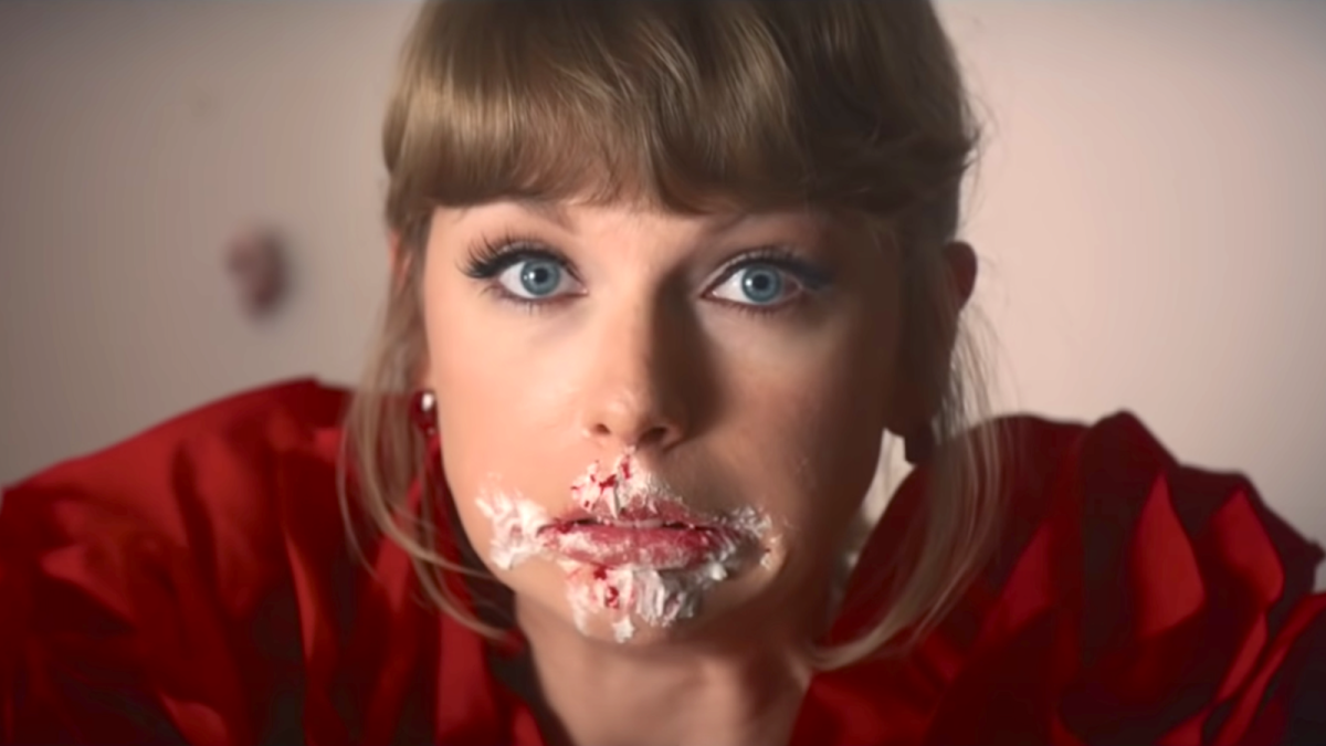 Taylor Swift with a face full of cake
