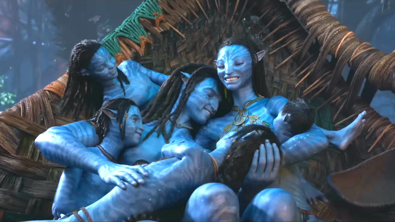 Jake Sully (Sam Worthington) and Neytiri (Zoe Saldana) hugging their children