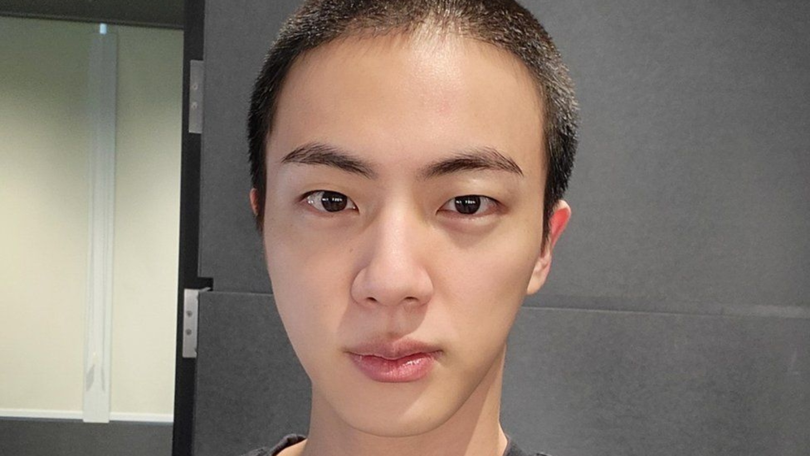 BTS' Jin shaves head