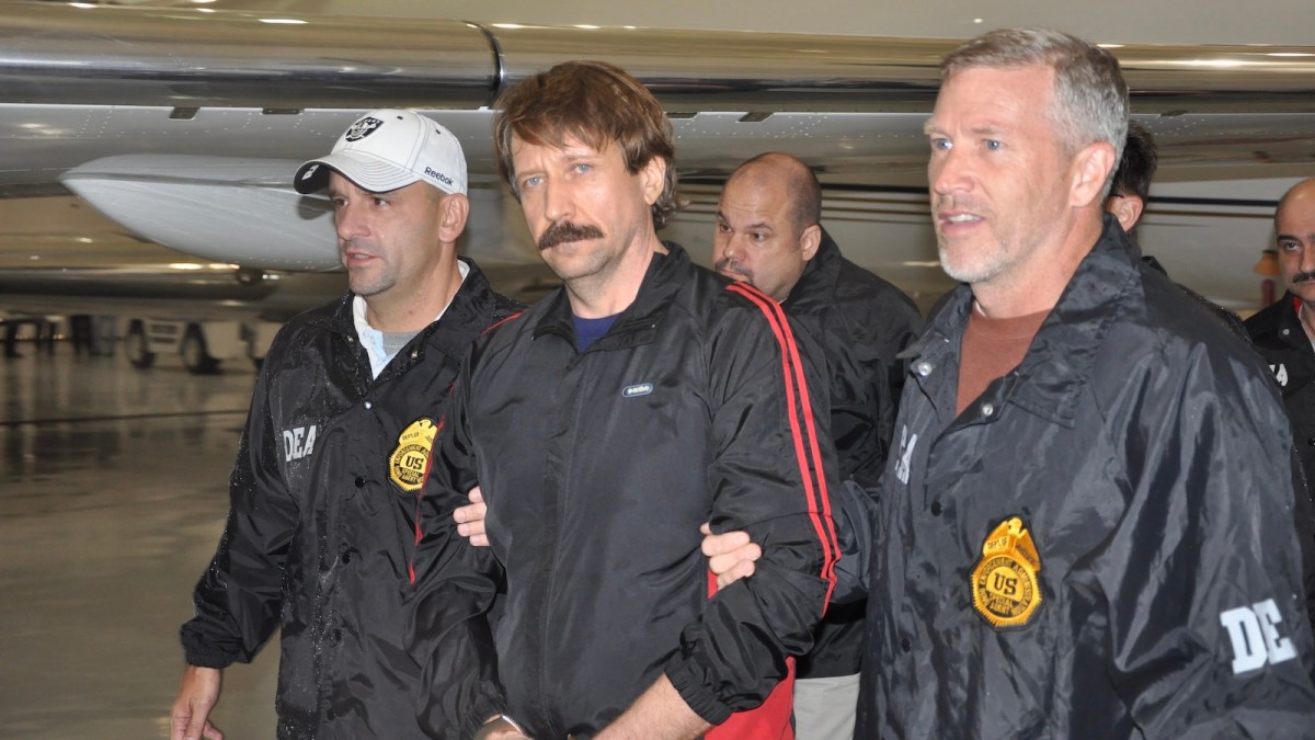 WHITE PLAINS, NY - NOVEMBER 16: In this photo provided by the U.S. Department of Justice, former Soviet military officer and arms trafficking suspect Viktor Bout (C) deplanes after arriving at Westchester County Airport November 16, 2010 in White Plains, New York. Bout was extradited from Thailand to the U.S. to face terrorism charges after a final effort by Russian diplomats to have him released failed.