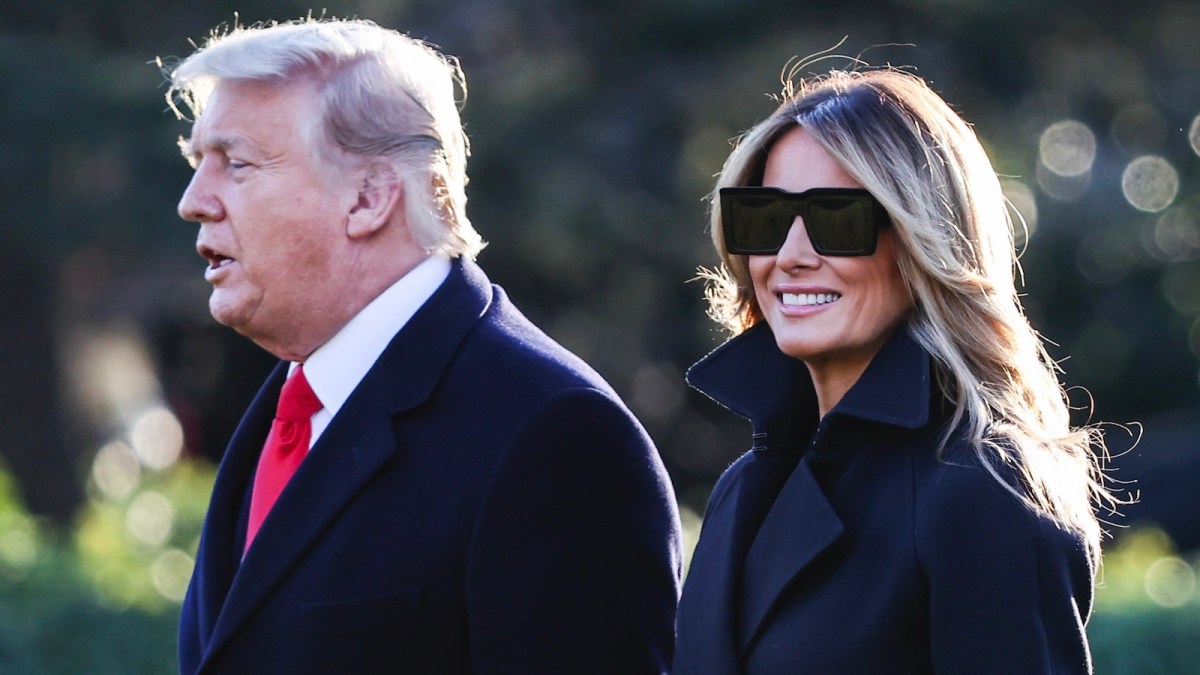 WASHINGTON, DC - DECEMBER 23: President Donald Trump and first lady Melania Trump walk on the south lawn of the White House on December 23, 2020 in Washington, DC. The Trumps are headed to Mar-a-Lago for the holidays with a government shutdown possible on Monday December 28.