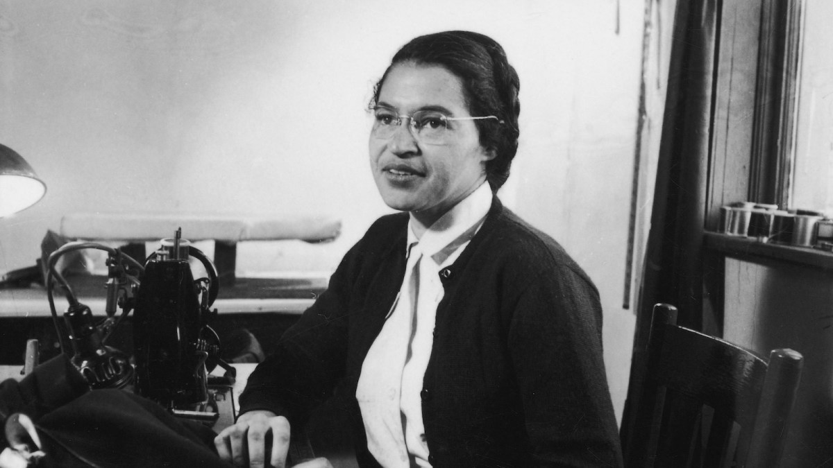 American Civil Rights activist Rosa Parks poses as she works as a seamstress, shortly after the beginning of the Montgomery bus boycott, Montgomery, Alabama, February 1956.