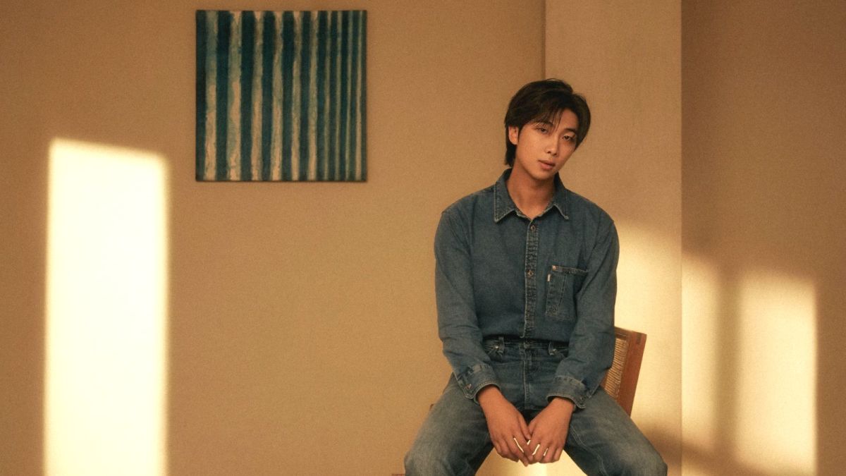 RM sits on a chair pensively