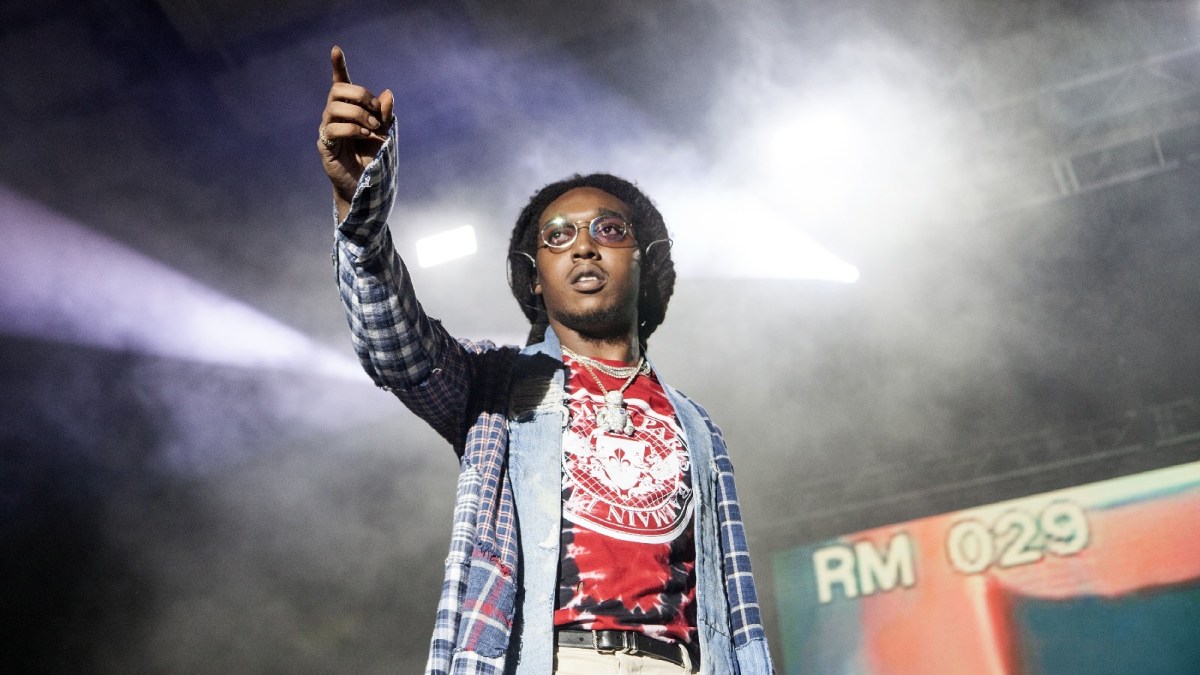 Takeoff performs at a concert.