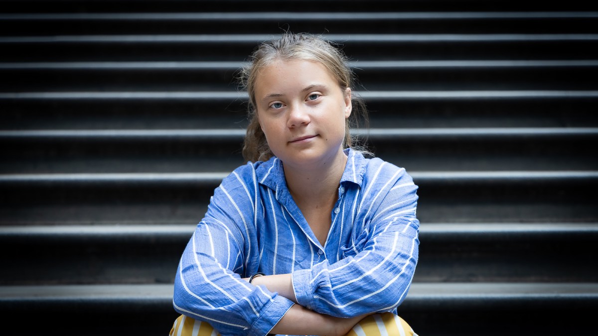 Climate activist Greta Thunberg sits for a photo on the steps of the Museum’s central Hintze Hall at Natural History Museum on June 27, 2022 in London, England. Thunberg teamed up with the Natural History Museum to produce an event for school students centred around biodiversity loss, one of the themes of her forthcoming book, The Climate Book.