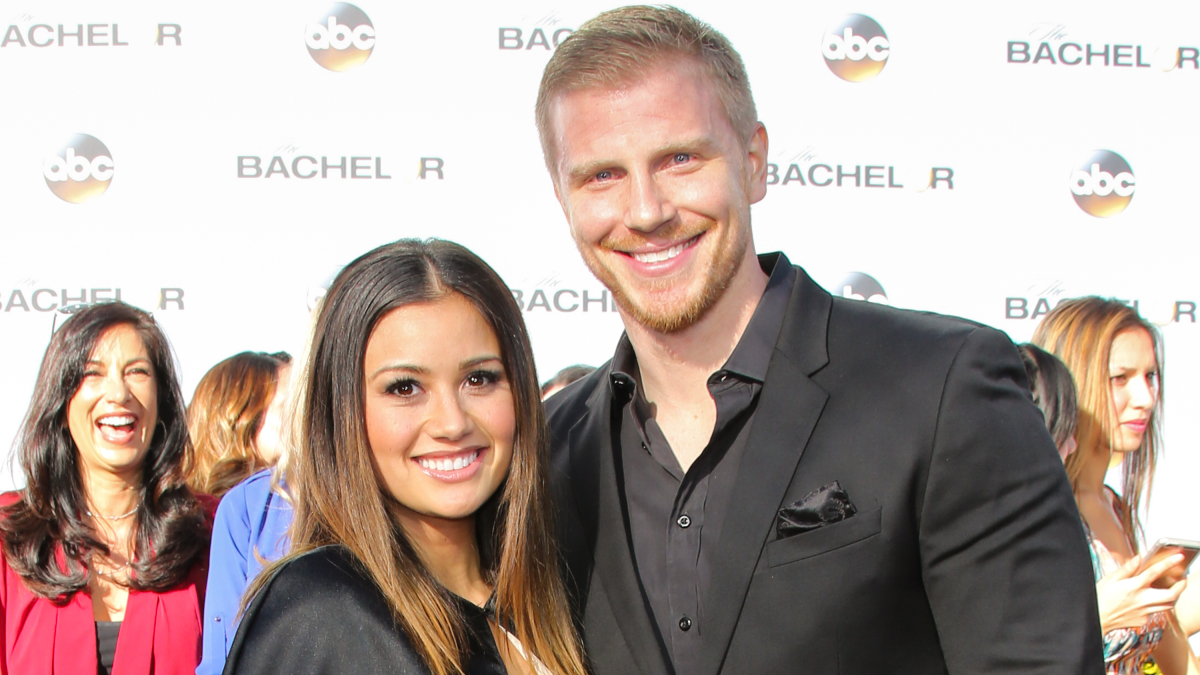 Sean Lowe is standing next to a woman on a red carpet.