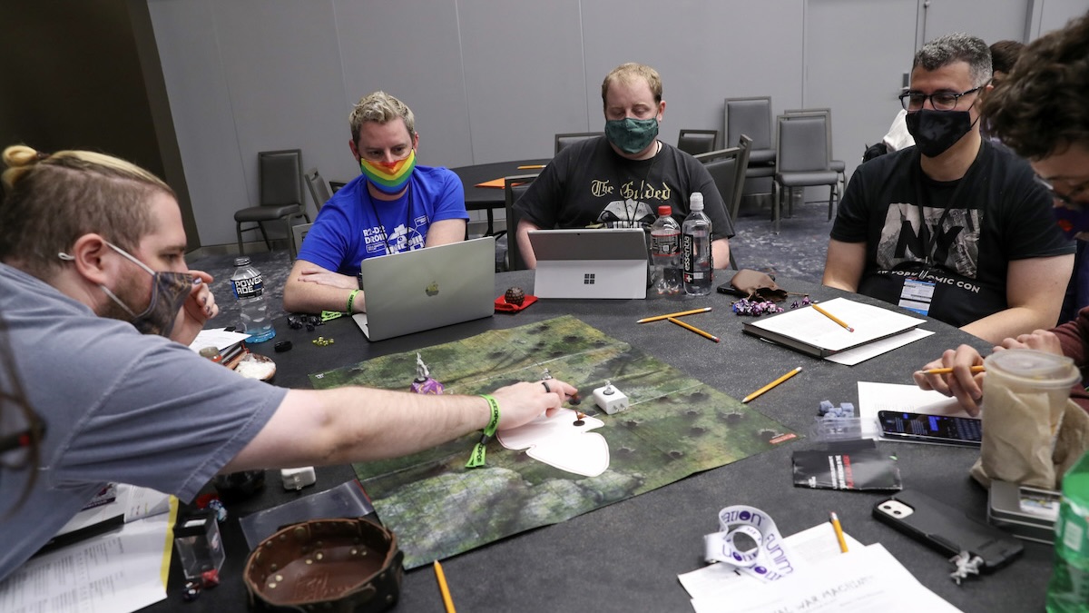 NEW YORK, NEW YORK - OCTOBER 10: Fans play Dungeons & Dragons in the Table Top Gaming area during Day 4 of New York Comic Con 2021 at Jacob Javits Center on October 10, 2021 in New York City.