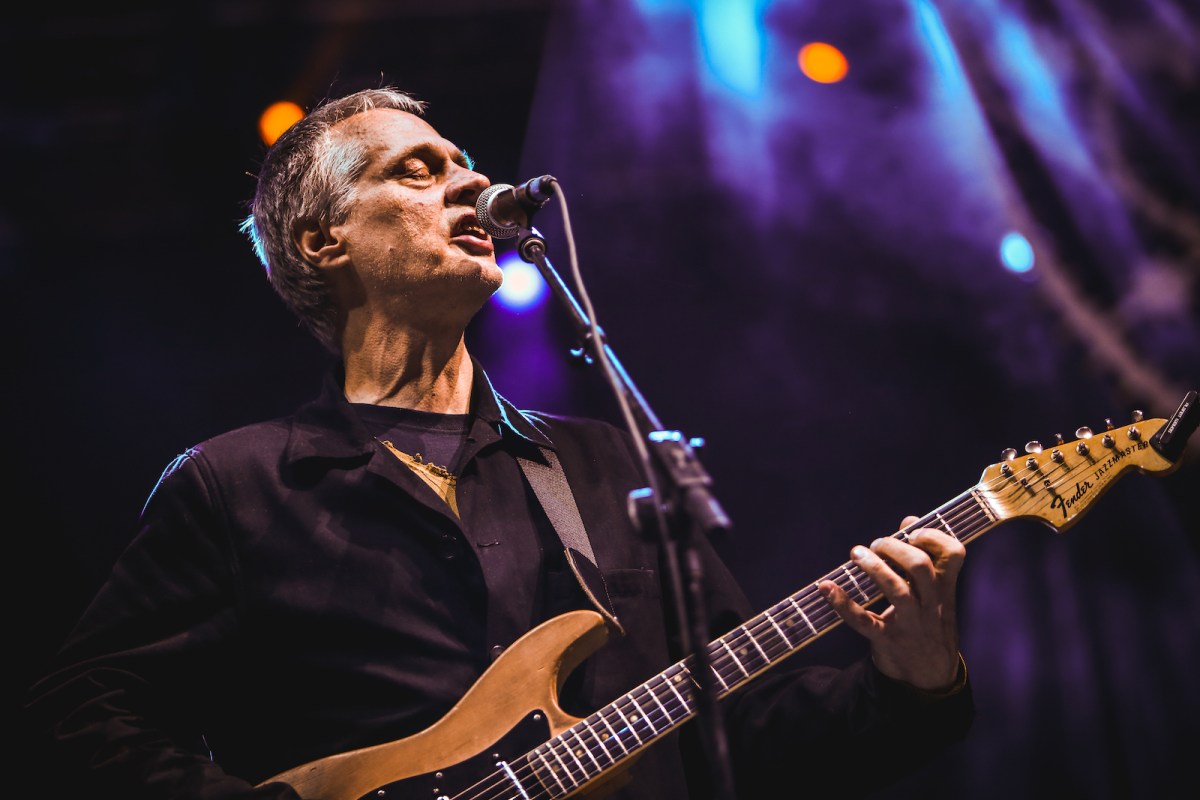 A photo of Tom Verlaine performing with his band Television at Fun Fun Fun Fest in Austin, TX on November 9, 2013. He plays a Fender Jazzmaster guitar.