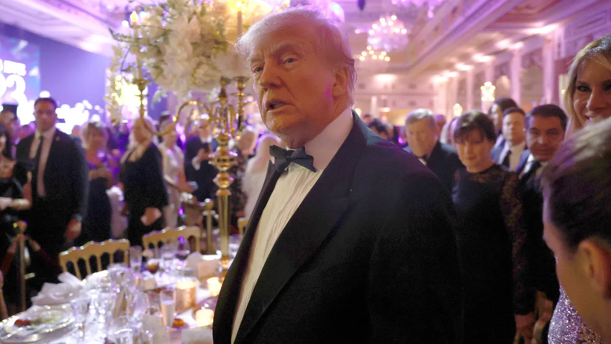 Former U.S. President Donald Trump greets people as he arrives for a New Years event at his Mar-a-Lago home on December 31, 2022 in Palm Beach, Florida. Trump continues to run for a second term as the President of the United States.