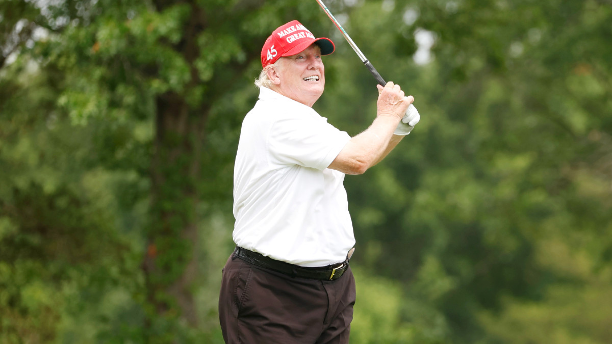 Former U.S. President Donald Trump plays his shot from the 14th tee during the pro-am prior to the LIV Golf Invitational - Bedminster at Trump National Golf Club Bedminster on July 28, 2022 in Bedminster, New Jersey.