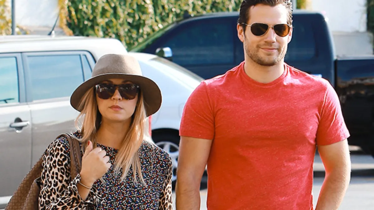 Henry Cavill and Kaley Cuoco are walking together.
