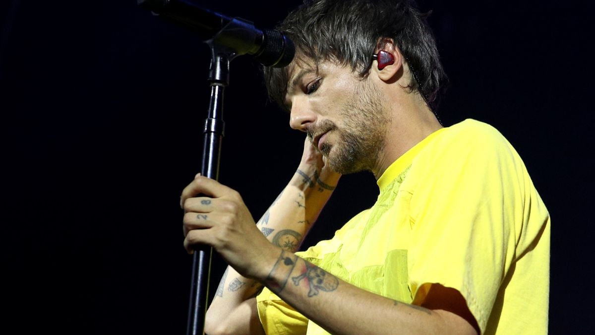 Louis Tomlinson of One Direction performing in concert at St James