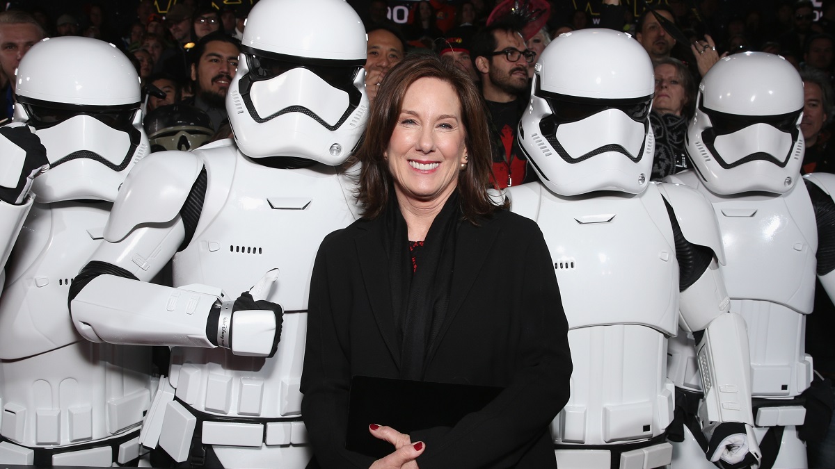 HOLLYWOOD, CA - DECEMBER 14: Lucasfilm President Kathleen Kennedy poses with Stormtroopers at the Premiere of Walt Disney Pictures and Lucasfilm's "Star Wars: The Force Awakens" at on December 14, 2015 in Hollywood, California.
