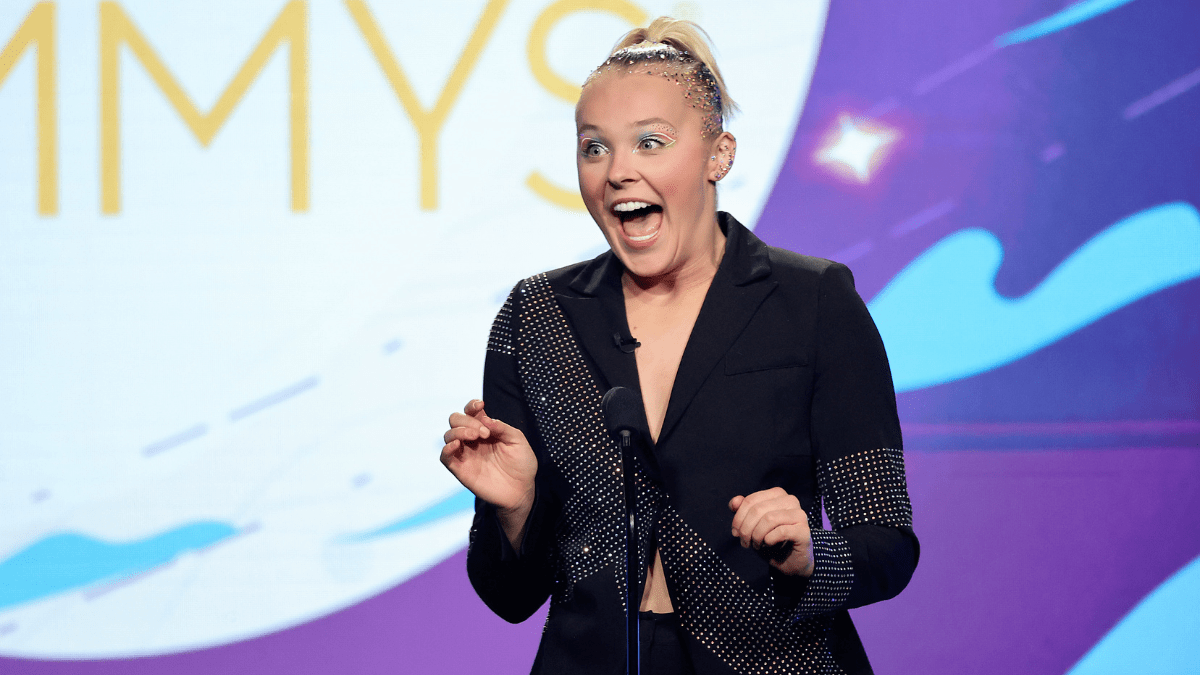 LOS ANGELES, CALIFORNIA - DECEMBER 10: Host JoJo Siwa speaks onstage during the 2022 Children's & Family Creative Arts Emmys at Wilshire Ebell Theatre on December 10, 2022 in Los Angeles, California.