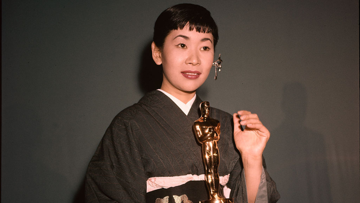 LOS ANGELES,CA - MARCH 26,1958: Japanese American actress Miyoshi Umeki poses with her Academy Award for Best Supporting Actress in "Sayonara" in Los Angeles, CA.
