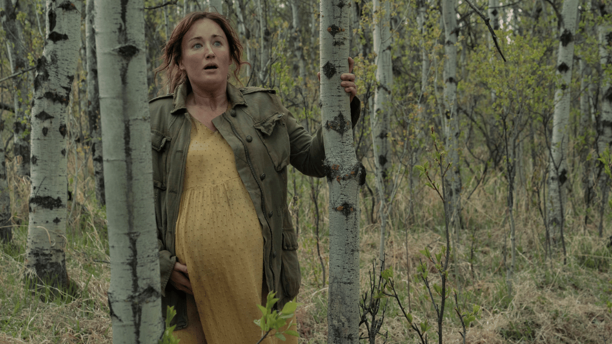 Anna (Ashley Johnson) walking through a forest