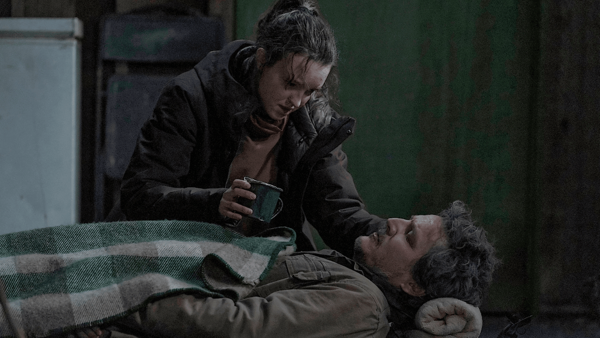 Ellie (Bella Ramsey) feeding an injured Joel (Pedro Pascal) in 'The Last of Us'