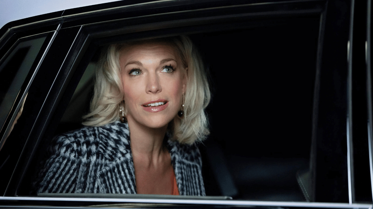 Rebecca (Hannah Waddingham) looking out of a car window