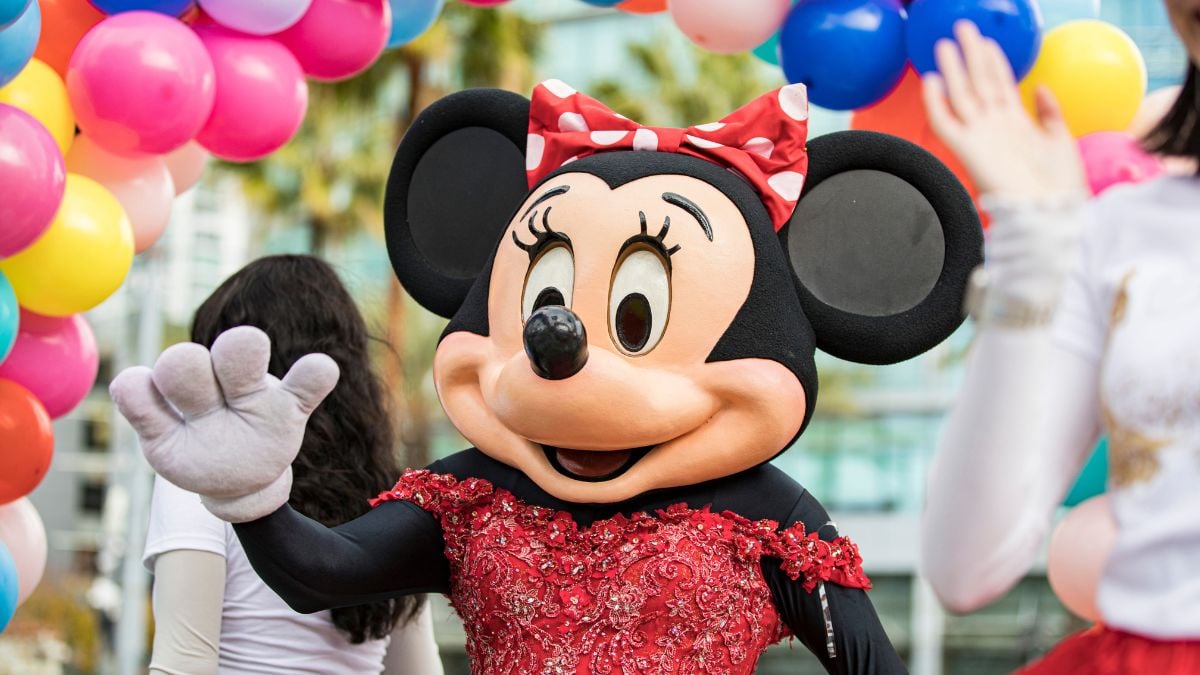 SAN DIEGO, CALIFORNIA - DECEMBER 28: A member Herencia Hispana dressed as Minnie Mouse performs in the Port of San Diego Holiday Bowl Parade on December 28, 2022 in San Diego, California. Billed as America's Largest Balloon Parade, the annual event draws over 100,000 spectators.