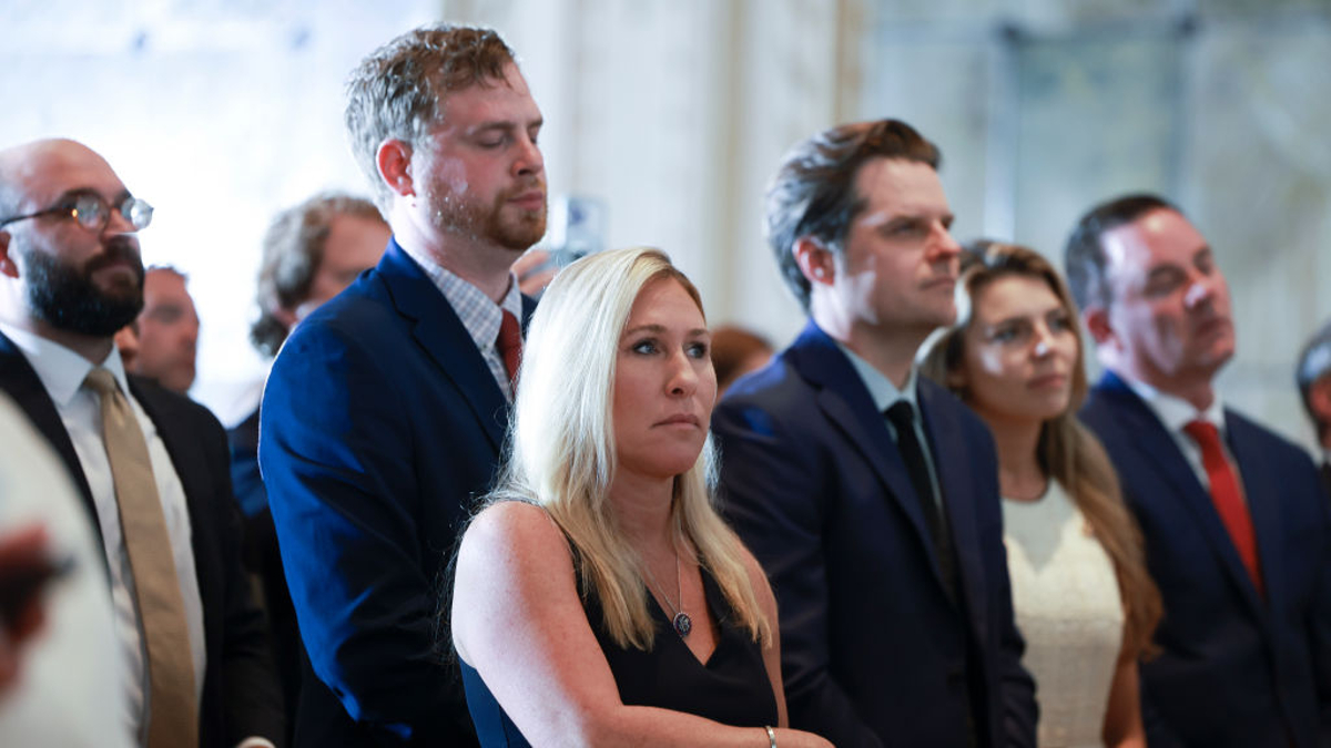 Reps. Marjorie Taylor Greene (R-GA) and Matt Gaetz (R-FL) (C, right) listen as former President Donald Trump speaks during an event at Mar-a-Lago April 4, 2023 in West Palm Beach, Florida. Trump pleaded not guilty in a Manhattan courtroom today to 34 counts related to money paid to adult film star Stormy Daniels in 2016, the first criminal charges for any former U.S. president.