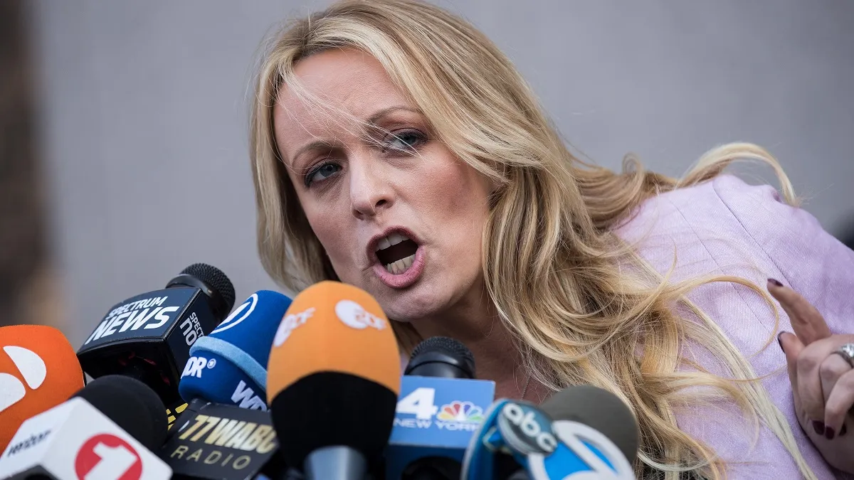 NEW YORK, NY - APRIL 16: Adult film actress Stormy Daniels (Stephanie Clifford) speaks to reporters as she exits the United States District Court Southern District of New York for a hearing related to Michael Cohen, President Trump's longtime personal attorney and confidante, April 16, 2018 in New York City. Cohen and lawyers representing President Trump are asking the court to block Justice Department officials from reading documents and materials related to Cohen's relationship with President Trump that they believe should be protected by attorney-client privilege. Officials with the FBI, armed with a search warrant, raided Cohen's office and two private residences last week.