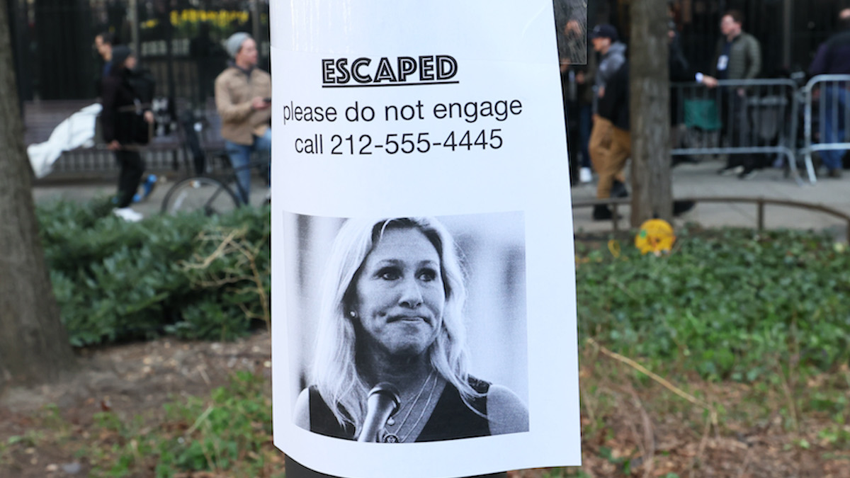 NEW YORK, NEW YORK - APRIL 04: A fake ad about Rep. Marjorie Taylor Greene (R-GA) is posted at Collect Pond Park ahead of former President Donald Trump's arraignment hearing on April 04, 2023 in New York City. Former President Trump will be arraigned during his first court appearance following an indictment by a grand jury that heard evidence on hush money paid to adult film star Stormy Daniels before the 2016 presidential election.