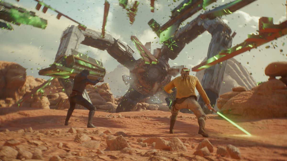 Two characters are holding green light sabers in a desert in Star Wars Jedi: Survivor.
