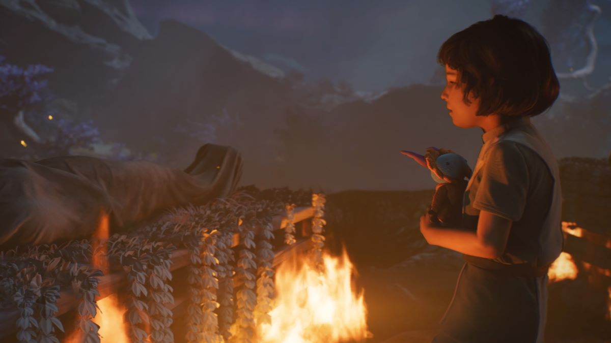 A young girl is standing in front of a fire in Star Wars Jedi: Survivor.