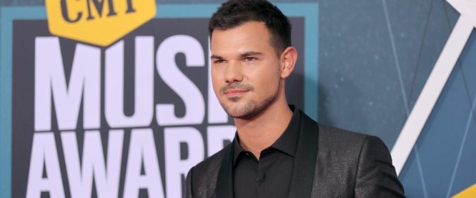 Taylor Lautner feels safe with Taylor Swift’s ‘Speak Now’ re-release, but is ‘praying for John’