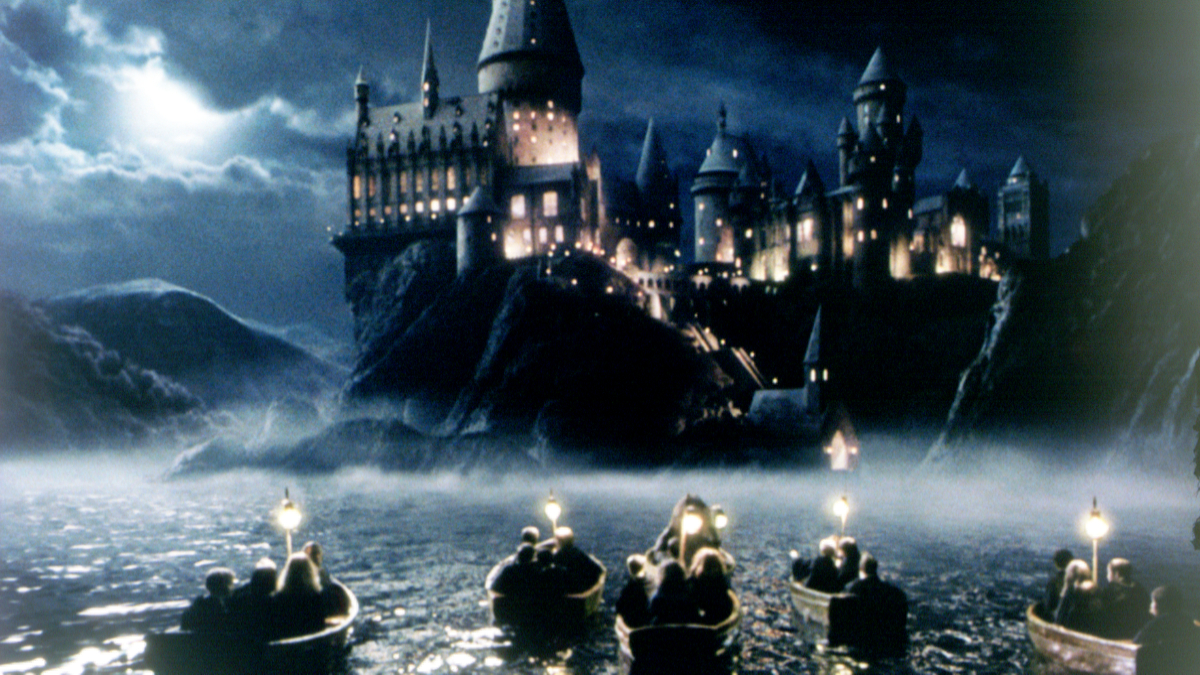 The children in their rowing boats approach Hogwarts School of Witchcraft and Wizardry 