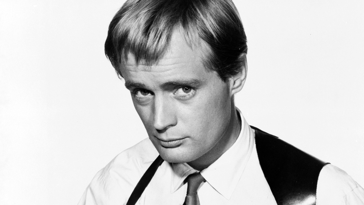 David McCallum is looking at the camera in a black and white picture.
