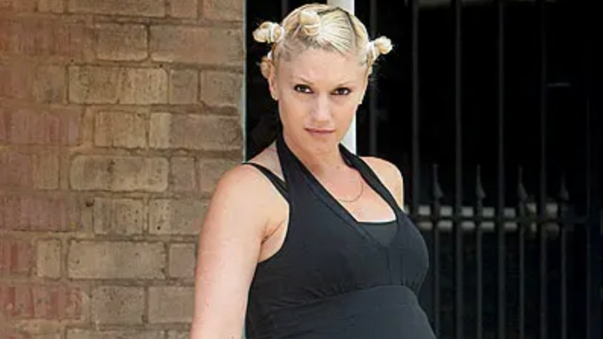 Gwen Stefani has her hair in buns and is looking straight ahead.