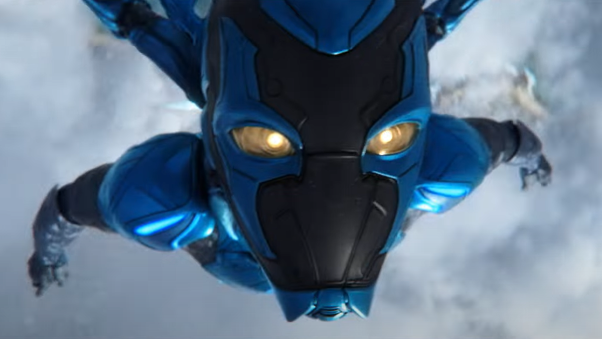 Blue Beetle flying directly at the screen