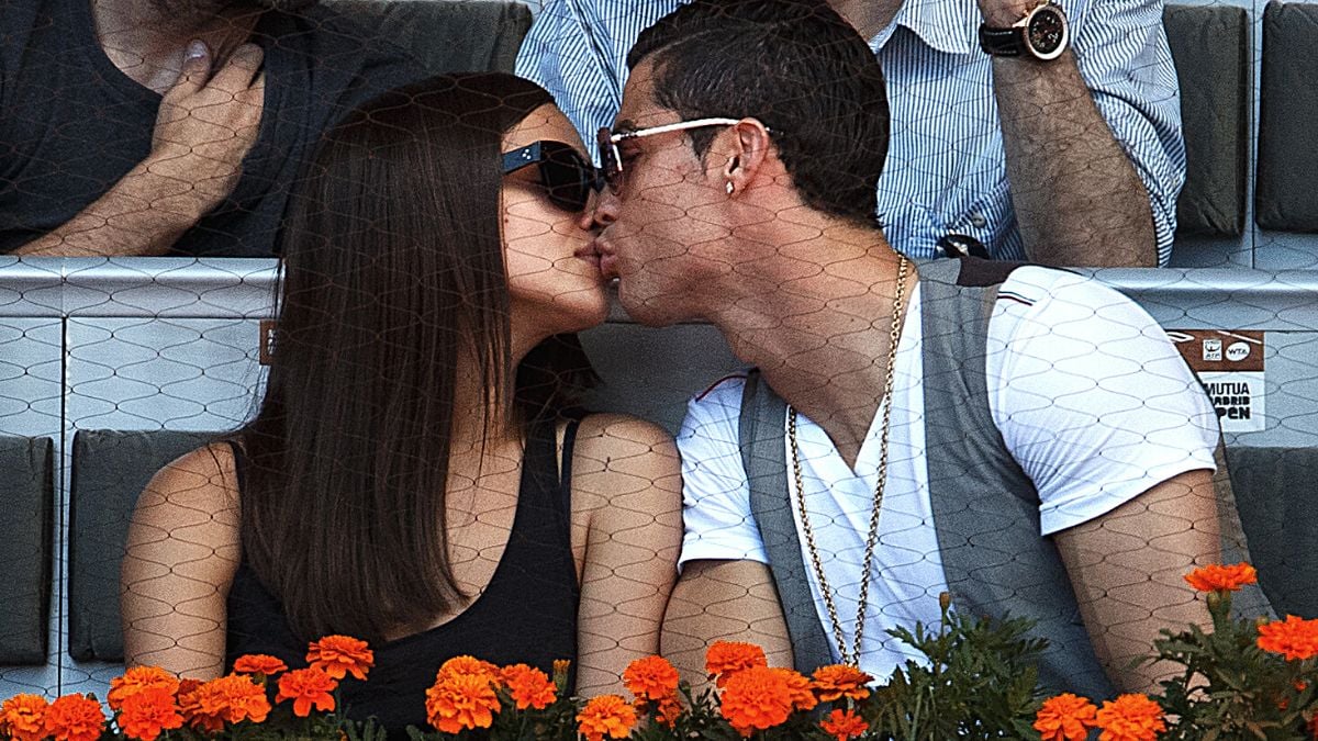 MADRID, SPAIN - MAY 10: Real Madrid player Cristiano Ronaldo (R) kisses his girlfriend Irina Shayk during the match between Rafael Nadal and David Ferrer of Spain on day seven of the Mutua Madrid Open tennis tournament at the Caja Magica on May 10, 2013 in Madrid, Spain. 