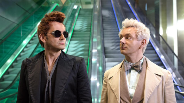 Crowley (David Tennant) and Aziraphale (Michael Sheen) stand in front of the stairways to heaven and hell in a Good Omens season 1 promo photo