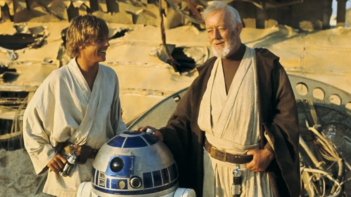 Mark Hamill como Luke Skywalker e Alec Guinness como Obi-Wan Kenobi em 'Star Wars: Uma Nova Esperança'
